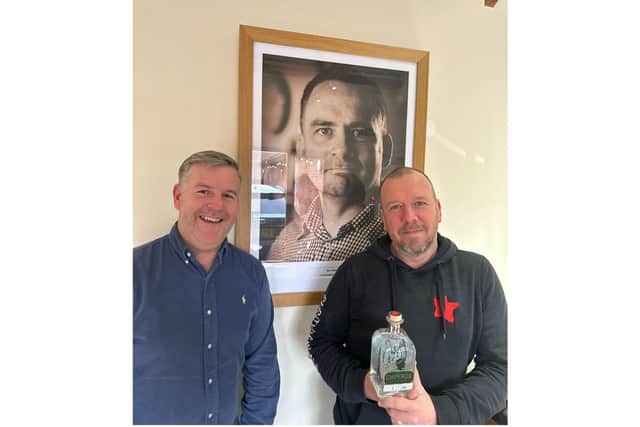 David Blick and John Conod pictured with a portrait of Purity co-founder, the late Jim Minkin who inspired the new gin. Photo supplied