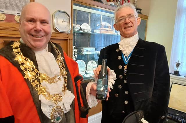 Mayor of Nuneaton Cllr Jeff Clarke with his gift from High Sheriff David Kelham.