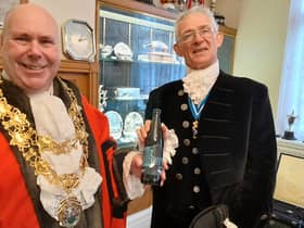 Mayor of Nuneaton Cllr Jeff Clarke with his gift from High Sheriff David Kelham.