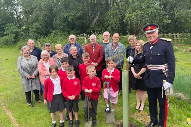 Timothy Cox, Lord Lieutenant of Warwickshire, joined children in planting the tree at a special celebration held at the school in Church Lane in  Barford, to celebrate Her Majesty’s 70th year on the throne. 
The tree-planting ceremony was the focal point of the event which was open to the Barford community, and a nod to the past with an oak tree having been planted by the school in the village playing fields to mark the Queen’s Coronation. Photo supplied