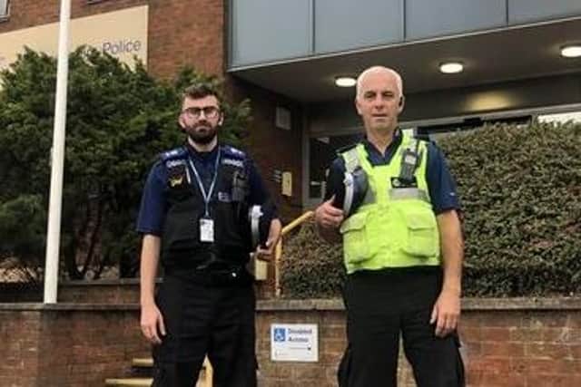PCSO Stephen McGuire, left, with fellow PCSO Tony Winter, outside Rugby police station.