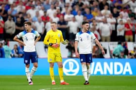 England's John Stones, goalkeeper Jordan Pickford and Declan Rice during the FIFA World Cup Quarter-Final match at the Al Bayt Stadium in Al Khor, Qatar. Picture: Nick Potts/PA Wire.