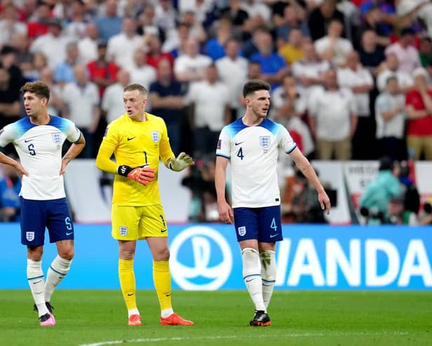 England's John Stones, goalkeeper Jordan Pickford and Declan Rice during the FIFA World Cup Quarter-Final match at the Al Bayt Stadium in Al Khor, Qatar. Picture: Nick Potts/PA Wire.