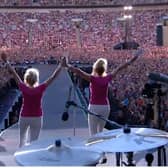 Barbara Graham and her sister Janette Fairclough take to the stage in front of 90,000 people to announce Coldplay at the band's recent concert at Wembley Stadium. Picture supplied.