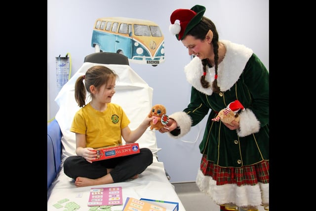 Warwick Castle staff and Elves surprised children on Warwick Hospital children's ward with board games and toys. Photo by Warwick Castle
