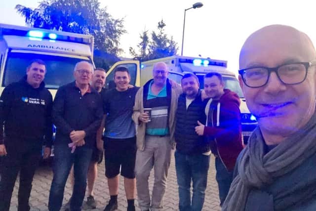 Warwick and Leamington MP Matt Western takes a selfie with members of the eight-man humanitarian aid team on their way to taking aid and vehicles to Ukraine.