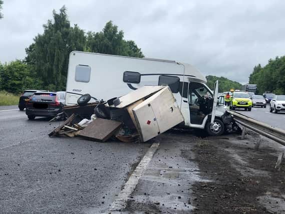 A motorhome lost control in the wet and collided with the central barrier on the M40 near junction 15.