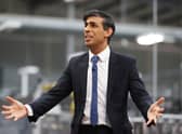 Rishi Sunak talks to local business leaders during a visit to a Coca-Cola factory in Lisburn, Northern Ireland yesterday (Picture: Liam McBurney/WPA pool/Getty Images)