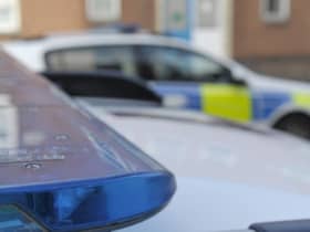 A four-year-old girl has died in a dog attack on Milton Keynes. File picture shows police cars.