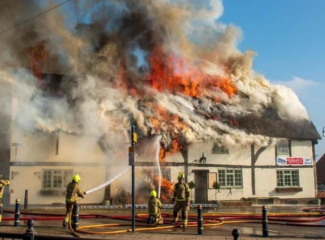 The fire ripped through the thatched roof yesterday (Monday). Photo by Harry Adkins.