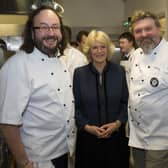 LONDON, ENGLAND - JANUARY 27: Camilla, Duchess of Cornwall (C) and Hairy Bikers Dave Myers (L) and Si King (R) attend the British Food Fortnight Secondary School Competition at Clarence House, on January 27, 2011 in London, England. The students prepared a meal for Camilla, Duchess of Cornwall and guests as part of the competition prize. (Photo by Arthur Edwards - WPA Pool/Getty Images)