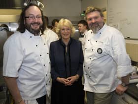 LONDON, ENGLAND - JANUARY 27: Camilla, Duchess of Cornwall (C) and Hairy Bikers Dave Myers (L) and Si King (R) attend the British Food Fortnight Secondary School Competition at Clarence House, on January 27, 2011 in London, England. The students prepared a meal for Camilla, Duchess of Cornwall and guests as part of the competition prize. (Photo by Arthur Edwards - WPA Pool/Getty Images)