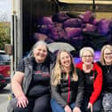 Rugby Slimming World consultants with the clothes donations.