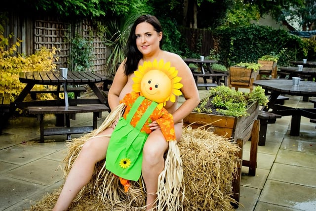 Kerry Prosser, 34, The Royal Oak manager, is featured on the calendar page for July, themed after The Crick Scarecrow Festival.