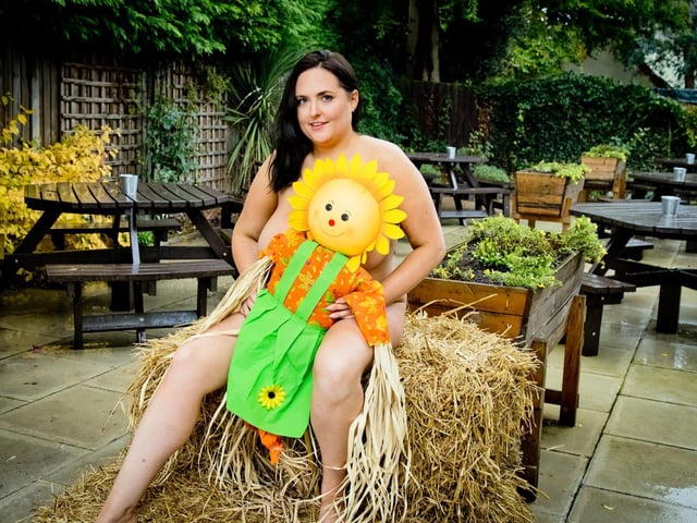 Kerry Prosser, 34, The Royal Oak manager, is featured on the calendar page for July, themed after The Crick Scarecrow Festival.