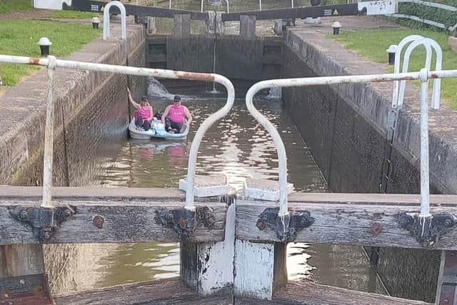 The pair navigating locks along the canal. Photo supplied