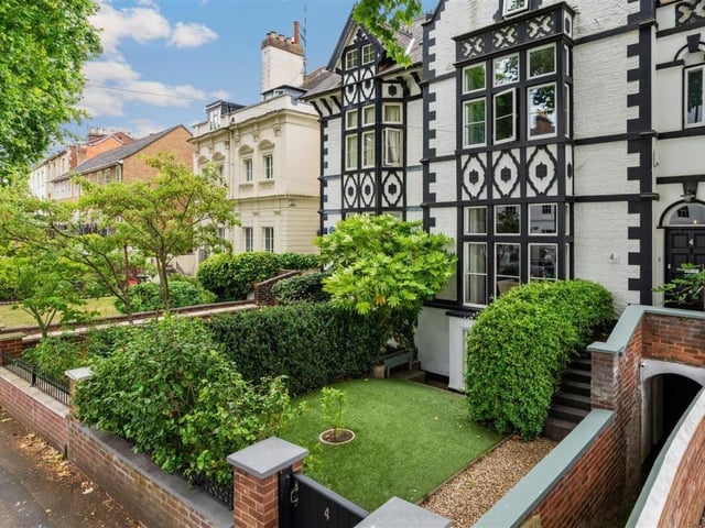 The property stands out with its black and white facade. Photo by Fine and Country