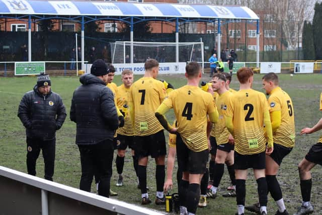 Warwick take a breather from the mudbath pitch at Lye Town.