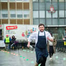 The ;Pancake Race' in Warwick town centre in 2023. Photo shows the adults' races. Photo by Mike Baker