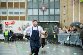 The ;Pancake Race' in Warwick town centre in 2023. Photo shows the adults' races. Photo by Mike Baker