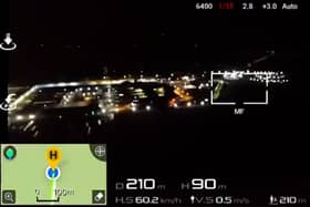Footage from one smuggling operation shows a drone hovering over a prison at night while lowering mobile phones on a fishing line.