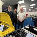 Three of the current team at Carvells - Scott Young, Jamie Ward and John Bowles - are pictured in their extended showroom with the eye-catching Smeg drinks cooler in the shape of a Fiat 500.