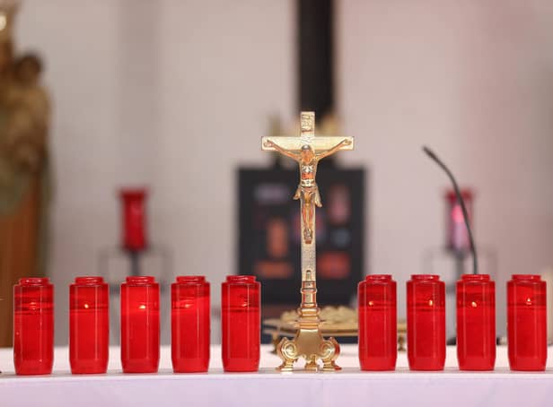 Ten candles are lit at the altar of St Michael's church in the village of Creeslough in Co Donegal for the victims of the explosion at Applegreen service station on Friday. Picture date: Monday October 10, 2022.