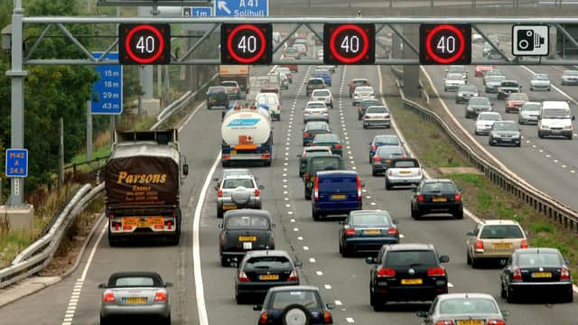 Motorists drive on the hard shoulder of one of the busiest stretches of motorway in Britain between junctions 3 and 7 of the M42