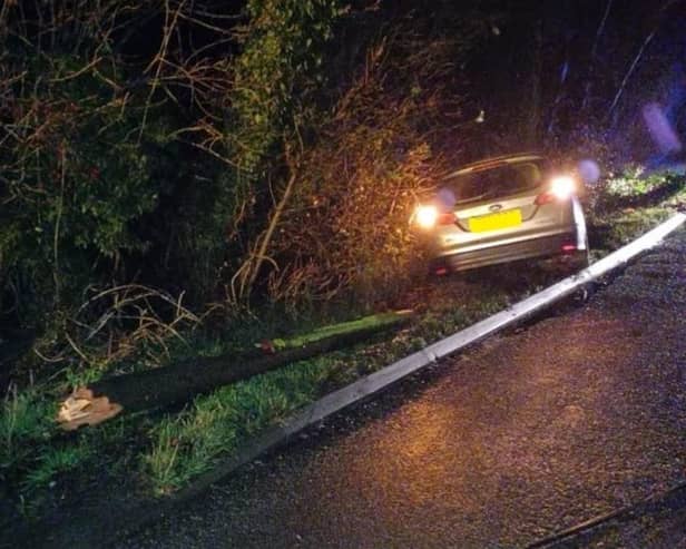 A suspect drink driver has been arrested after he drove into a telegraph pole near Leamington - causing part of the pole to land on another car.