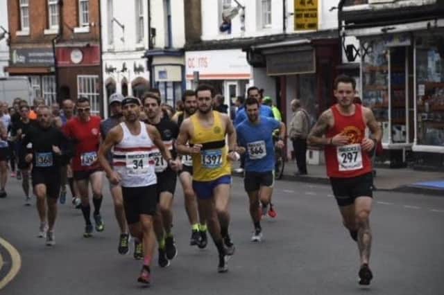 Runners in Alcester High Street - there will now be two chances to tackle a 10k in the historic town