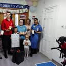 Leo Ozga and his family present the reading lamps to staff at Birmingham Children's hospital. Picture supplied.