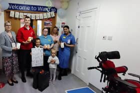 Leo Ozga and his family present the reading lamps to staff at Birmingham Children's hospital. Picture supplied.