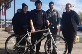 Joel with his new bike, pictured with (left-right) mum Rebecca, dad Liam and Emily, deputy manager of the Rugby branch of Halfords.