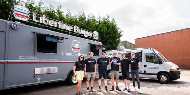 Libertine Burger staff celebrate latest award.