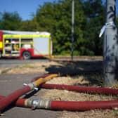 London Fire Brigade dealing with the aftermath of a grass fire in Rainham, east London. The Met Office has issued an amber warning for extreme heat covering four days from Thursday to Sunday for parts of England and Wales as a new heatwave looms. Picture date: Wednesday August 10, 2022.