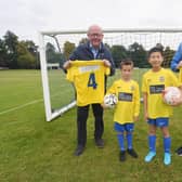 The new boys’ kit for Kenilworth Wardens Junior Football Club, sponsored by Talisman Shopping Centre and Wareing &amp; Company. From left: Bill Wareing, Oliver Hales (7), Oscar Hua (11) and Andrew Watts. Photo supplied