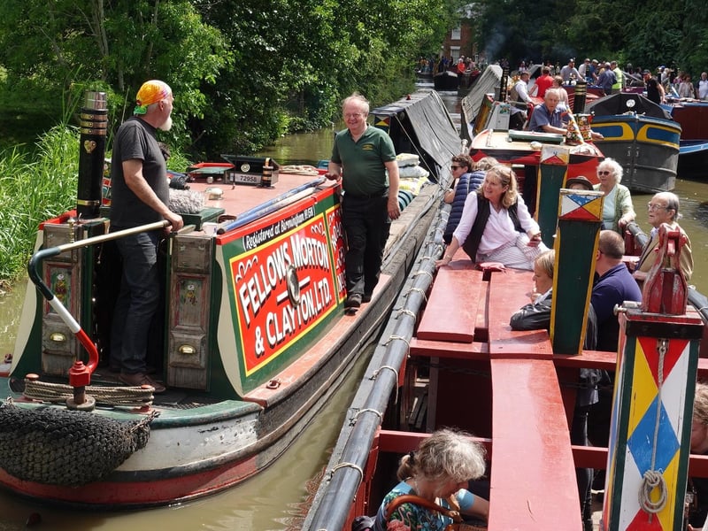 Friends of Raymond and special guests pictured on The Raymond narrowboat passing the Roach in the boat parade at the 2022 rally.