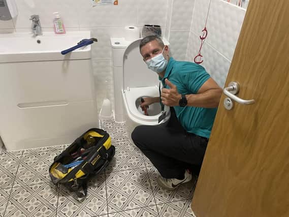 CEO Andrew Winstanley helping with bathroom maintenance. Photo supplied