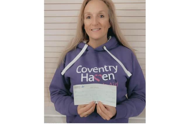 Jaime Richards receives the cheque on behalf of Coventry Haven. Photo supplied