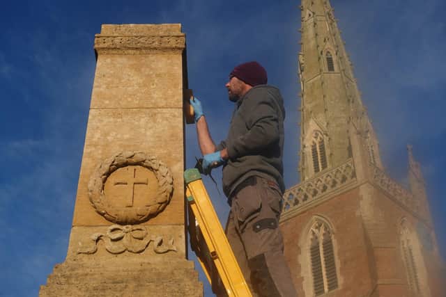 Master stonemason Steve Hancock putting the finishing touches to the makeover of Braunston’s War Memorial. Picture: Tom Coghlan.