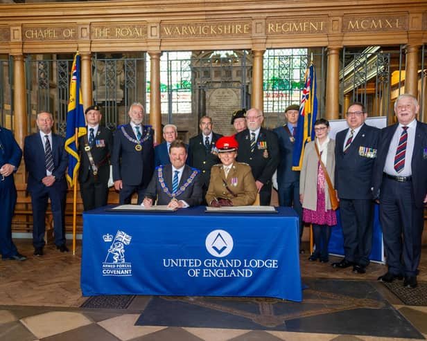 Warwickshire Freemasons recently signed the Armed Forces Covenant.  Philip Hall, Provincial Grandmaster and Lt. Col Samantha Brettell from HQ West Midlands, who signed on behalf of the MoD in the Regimental Chapel of the Royal Warwickshire Regiment in the Collegiate Church of St Mary in Warwick. Photo by Mike Baker