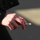 A woman smoking in central London.