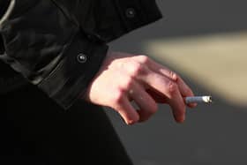 A woman smoking in central London.