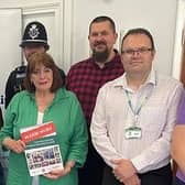Benn Partnership Centre Trustee Joyce Woodings and Centre Manager Vivien Kajoro, with Councilor Maggie O’Rourke, Mayor of Rugby, Councillor Richard Harrington, Michelle Gravatt, WCC, back row [L-R] Jackie Holcroft, WRCC, Andy Littlewood, NEA, Rugby PC Guy Mountford, and Dean Hamilton, WRCC.