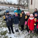 Ukrainian children show the eggs donated to them by the Leamington appeal.