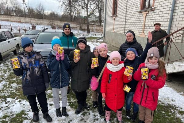 Ukrainian children show the eggs donated to them by the Leamington appeal.