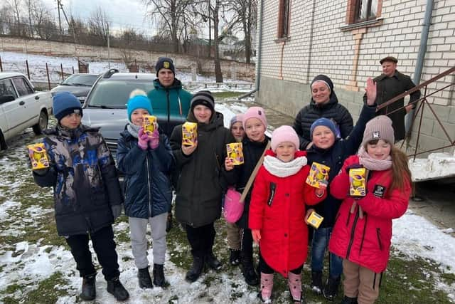 Ukrainian children show the eggs donated to them by the Leamington appeal.