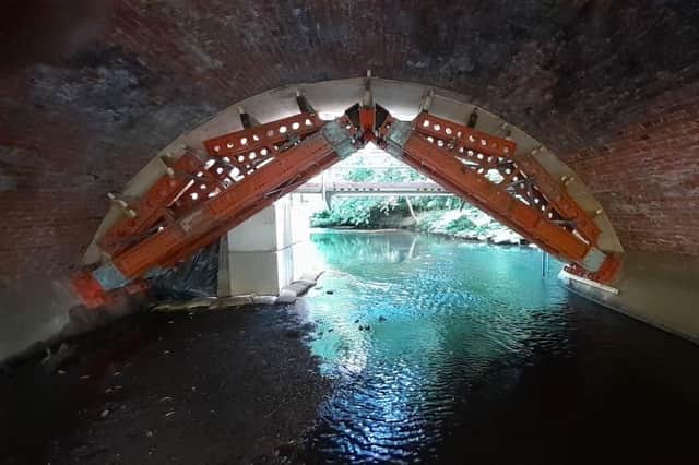 Heavy duty propping beneath the arches of Baginton Mill bridge make sure they remain safe while stones are replaced. Photo supplied by Warwickshire County Council