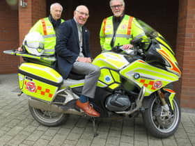 Left to right: Alan Brickwood, Warwick Rotary President Keith Talbot on WSBB’s BMW 1250RT bike and Martin Williams. Photo supplied