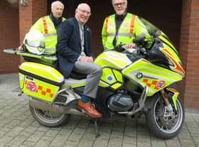 Left to right: Alan Brickwood, Warwick Rotary President Keith Talbot on WSBB’s BMW 1250RT bike and Martin Williams. Photo supplied
